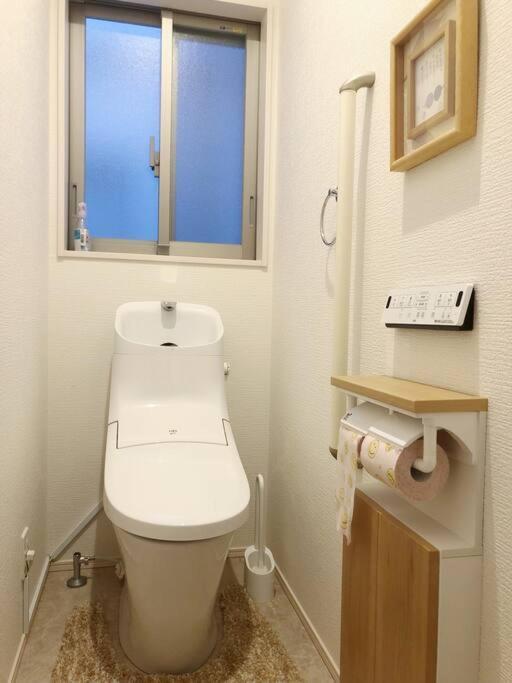 空港まで車で15分〜ビーチまで徒歩1分〜海沿いの野鶴居 Holiday home *