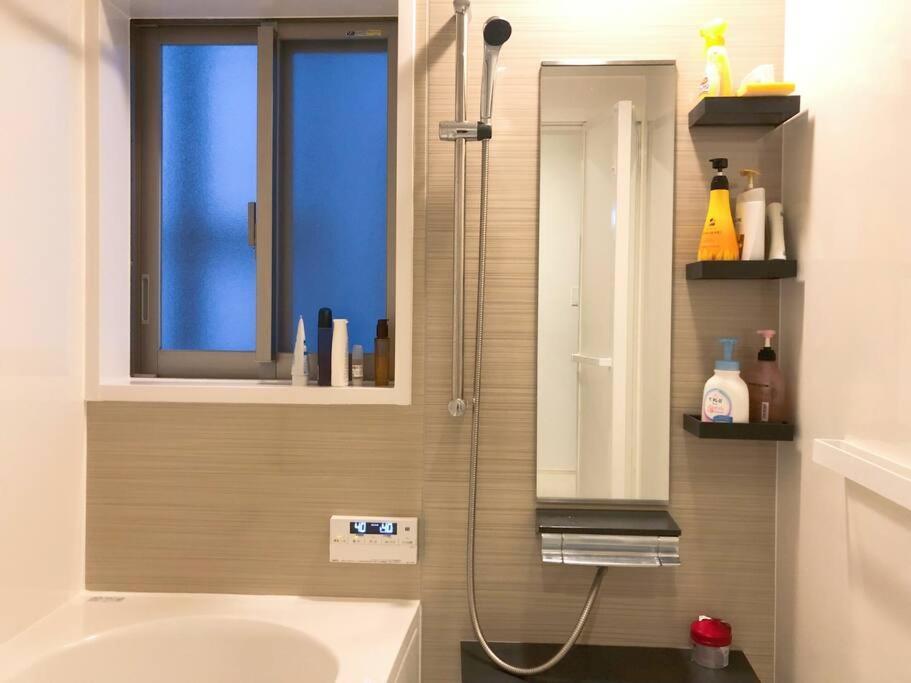 Holiday home 空港まで車で15分〜ビーチまで徒歩1分〜海沿いの野鶴居